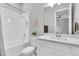 Clean and bright bathroom with a shower-tub combo, a vanity, and plenty of storage for a functional space at 12617 Wetmore Ct, Odessa, FL 33556