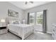 Bright bedroom with two windows, carpet, a queen-size bed and light walls at 12617 Wetmore Ct, Odessa, FL 33556