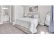 Neutral bedroom with a light colored queen-sized bed, carpet and access to the bathroom at 12617 Wetmore Ct, Odessa, FL 33556