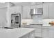 Well-equipped kitchen with stainless steel appliances and stylish backsplash at 12617 Wetmore Ct, Odessa, FL 33556