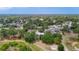 A beautiful aerial view of the neighborhood with mature trees, landscaping, and well-maintained homes at 1276 Meredith Dr, Spring Hill, FL 34608