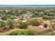 Aerial view of property and surrounding landscape, showing lot size and wooded area at 1276 Meredith Dr, Spring Hill, FL 34608