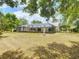 Large backyard with an in-ground pool and screen enclosure, ideal for outdoor living at 1276 Meredith Dr, Spring Hill, FL 34608