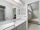 Bathroom featuring a sink, cabinets, mirror and a shower at 1276 Meredith Dr, Spring Hill, FL 34608