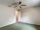 Bedroom featuring green carpet, ceiling fan, and light pink walls at 1276 Meredith Dr, Spring Hill, FL 34608