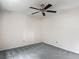 Bedroom featuring gray carpet, ceiling fan, and white walls at 1276 Meredith Dr, Spring Hill, FL 34608