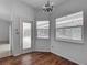Bright dining area features wood floors, a chandelier, and large windows overlooking the pool area at 1276 Meredith Dr, Spring Hill, FL 34608