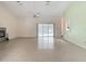 Spacious living room with a fireplace, tile flooring, sliding doors to the pool, and a ceiling fan at 1276 Meredith Dr, Spring Hill, FL 34608