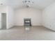 Open living room with tile flooring, fireplace, vaulted ceiling, and modern ceiling fan at 1276 Meredith Dr, Spring Hill, FL 34608