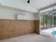 An outdoor patio features tiled wall accents and convenient access to the pool area through sliding glass doors at 1276 Meredith Dr, Spring Hill, FL 34608