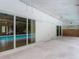 A covered outdoor living space flows into a pool area with sliding glass doors providing natural light and views at 1276 Meredith Dr, Spring Hill, FL 34608