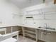 Utility room with sink and built-in shelving at 1276 Meredith Dr, Spring Hill, FL 34608