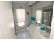 Bright bathroom with a white vanity, tile floors, and a shower with glass doors at 13100 Fish Cove Dr, Spring Hill, FL 34609