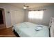 Bedroom with laminated wood floor, closet and window at 13100 Fish Cove Dr, Spring Hill, FL 34609