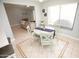 Bright breakfast nook with a round table, four chairs, and a window for natural light at 13100 Fish Cove Dr, Spring Hill, FL 34609