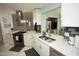 Bright kitchen featuring stainless steel appliances, sleek countertops and modern lighting at 13100 Fish Cove Dr, Spring Hill, FL 34609