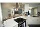 Bright kitchen featuring stainless steel appliances, sleek countertops and modern lighting at 13100 Fish Cove Dr, Spring Hill, FL 34609