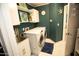 Efficient laundry room with white cabinets, a sink, and modern washer and dryer units at 13100 Fish Cove Dr, Spring Hill, FL 34609