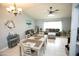 Cozy living room featuring neutral paint, tile floors, stylish furnishings, and plenty of natural light at 13100 Fish Cove Dr, Spring Hill, FL 34609