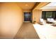 Covered front patio with chairs; a charming space for relaxing at 13100 Fish Cove Dr, Spring Hill, FL 34609