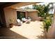 Covered patio with comfortable seating and plants at 13100 Fish Cove Dr, Spring Hill, FL 34609