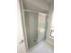 Bathroom shower with tile surround and glass sliding doors at 13100 Fish Cove Dr, Spring Hill, FL 34609
