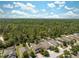 Aerial view of the community highlighting its prime location near a dense forest at 18331 Waydale Loop, Hudson, FL 34667