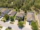 Aerial view of the home and surrounding neighborhood showcasing the manicured lawns at 18331 Waydale Loop, Hudson, FL 34667