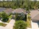 Aerial view of the home showing the roof, driveway, and surrounding neighborhood at 18331 Waydale Loop, Hudson, FL 34667