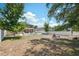 Spacious backyard features a pool, fire pit, and ample greenery, perfect for outdoor entertaining at 18331 Waydale Loop, Hudson, FL 34667