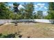 Spacious backyard featuring a fire pit and a privacy fence, offering a serene outdoor retreat at 18331 Waydale Loop, Hudson, FL 34667