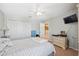 Bedroom with a ceiling fan and access to the hallway at 18331 Waydale Loop, Hudson, FL 34667