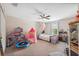 Bedroom with a ceiling fan and plenty of room for play at 18331 Waydale Loop, Hudson, FL 34667