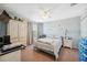 Bedroom with a window, ceiling fan, and a comfortable bed at 18331 Waydale Loop, Hudson, FL 34667