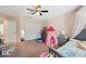 Bright bedroom with a ceiling fan and lots of space at 18331 Waydale Loop, Hudson, FL 34667