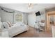 Charming bedroom with a large window, desk, and closet at 18331 Waydale Loop, Hudson, FL 34667