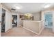 Upstairs hallway with neutral carpet and decor leading to bedrooms at 18331 Waydale Loop, Hudson, FL 34667