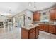 Updated kitchen with granite countertops and stainless appliances open to dining area at 18331 Waydale Loop, Hudson, FL 34667