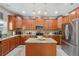 Updated kitchen with granite countertops, stainless steel appliances, and ample cabinet space at 18331 Waydale Loop, Hudson, FL 34667