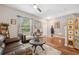 Inviting living room with hardwood floors, a comfortable sofa, and tasteful decor at 18331 Waydale Loop, Hudson, FL 34667