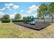 Neighborhood playground with green slides and play equipment, set in a grassy area at 18331 Waydale Loop, Hudson, FL 34667
