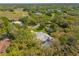 A high angle view of a home with mature trees and a private backyard pool at 18663 Autumn Lake Blvd, Hudson, FL 34667