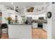 Bright kitchen featuring a breakfast bar, modern appliances, and ample counter space for cooking at 18663 Autumn Lake Blvd, Hudson, FL 34667