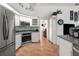 Modern kitchen featuring tile backsplash, stainless steel appliances, and ample counter space at 18663 Autumn Lake Blvd, Hudson, FL 34667
