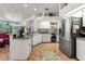 Modern kitchen boasting tile floors, granite countertops, white cabinets, and stainless steel appliances at 18663 Autumn Lake Blvd, Hudson, FL 34667