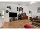 Cozy living room with neutral decor, large television, and comfortable seating arrangements at 18663 Autumn Lake Blvd, Hudson, FL 34667