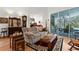 Comfortable living room with hardwood floors, stylish decor, and sliding glass doors to the pool area at 18663 Autumn Lake Blvd, Hudson, FL 34667