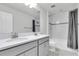 Bathroom featuring a double sink vanity and a shower-tub combination at 2431 Murray Pass, Odessa, FL 33556