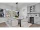 Modern dining room features natural light and a built in bar with wine cooler at 2431 Murray Pass, Odessa, FL 33556