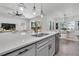 Modern kitchen with an island, stainless steel appliances, and open layout to the living room at 2431 Murray Pass, Odessa, FL 33556